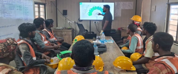 Workers in safety gear at construction site