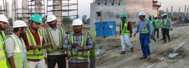 Workers in safety gear at construction site
